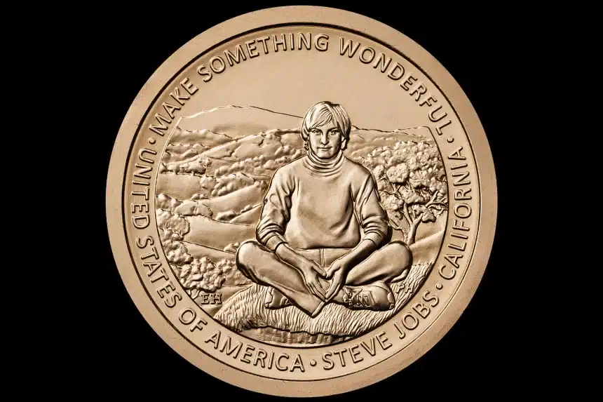 Gold coin featuring Steve Jobs sitting cross-legged with the inscription “Make Something Wonderful.”