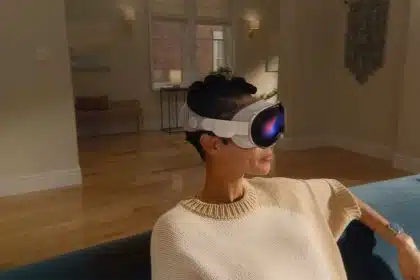 A person sitting on a couch wearing an Apple Vision Pro headset.