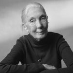 Black and white portrait of an elderly woman wearing a dark turtleneck sweater.