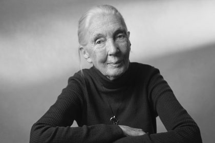 Black and white portrait of an elderly woman wearing a dark turtleneck sweater.