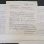 Apple’s 1976 founding documents displayed on a table.