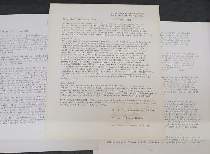 Apple’s 1976 founding documents displayed on a table.