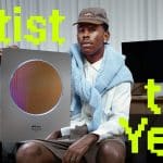 Tyler, the Creator holding his Apple Music Artist of the Year award.