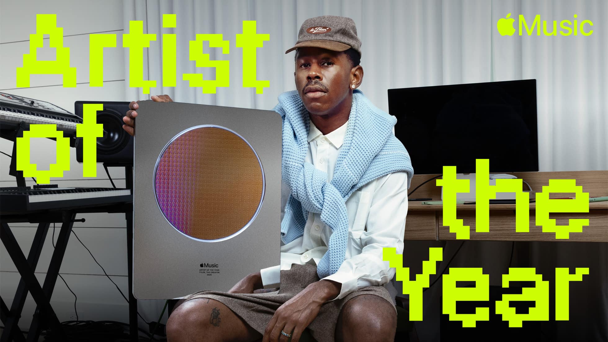 Tyler, the Creator holding his Apple Music Artist of the Year award.