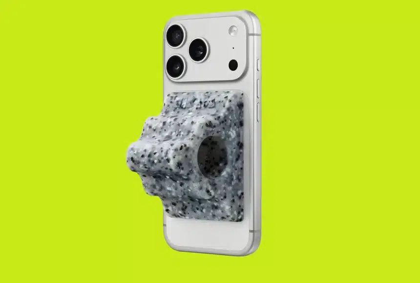 iPhone with a speckled gray grip attached on a bright green background.
