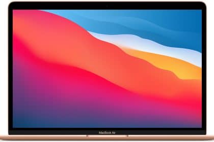 Apple MacBook Air with M1 chip displaying a colourful gradient screen.