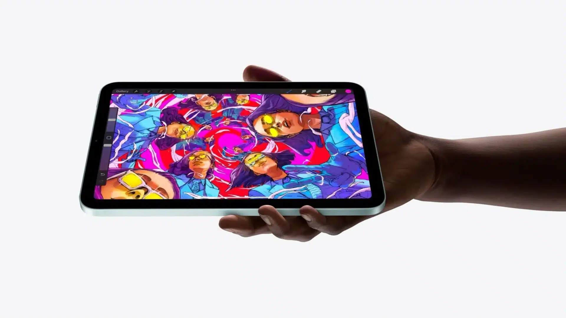 A hand holding an iPad mini displaying vibrant digital artwork.