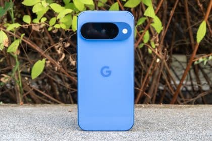 Blue Google Pixel phone standing upright outdoors.