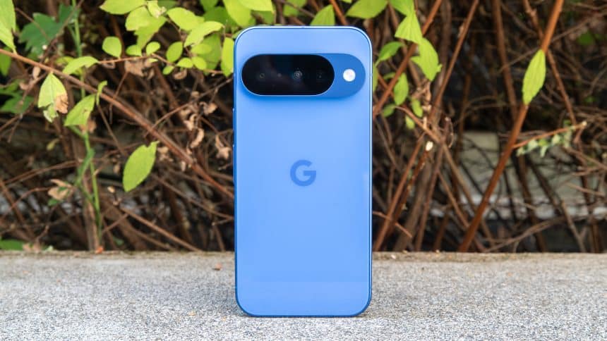 Blue Google Pixel phone standing upright outdoors.