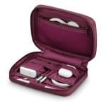 Dark Cherry travel case holding Apple chargers, cables, and accessories.