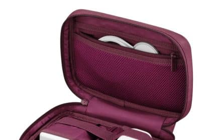 Dark Cherry travel case holding Apple chargers, cables, and accessories.