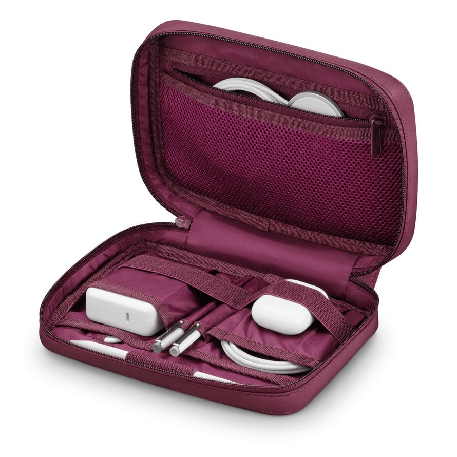 Dark Cherry travel case holding Apple chargers, cables, and accessories.