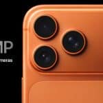 Close-up of an orange iPhone with three 48MP camera lenses on the back.