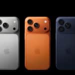 Three iPhone models in silver, orange, and navy blue shown from the back.