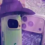 Two smartphones dressed as characters, with one wearing a witch hat and the other a tiara.