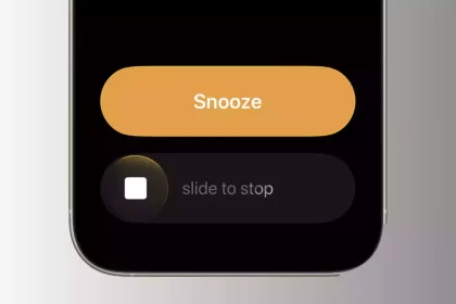 iPhone screen showing the new “slide to stop” alarm feature in iOS 26.1.