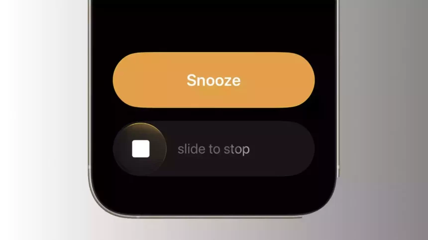 iPhone screen showing the new “slide to stop” alarm feature in iOS 26.1.