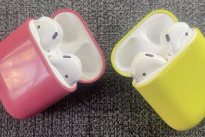 Pink and yellow AirPods charging case prototypes side by side.
