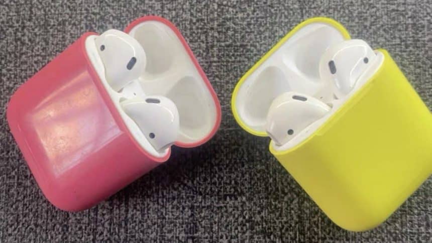 Pink and yellow AirPods charging case prototypes side by side.