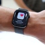 Apple Watch showing a possible hypertension notification on the screen.