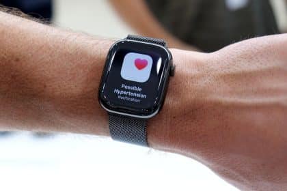 Apple Watch showing a possible hypertension notification on the screen.
