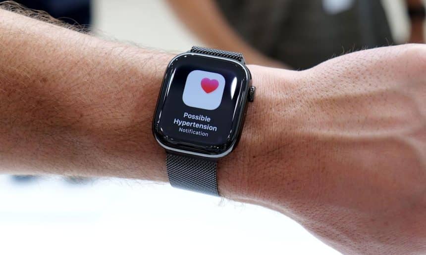 Apple Watch showing a possible hypertension notification on the screen.