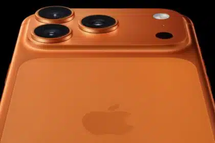 Close-up of an orange iPhone 17 Pro rear camera and Apple logo.