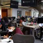 Students work on computers inside Detroit’s Apple Developer Academy classroom.