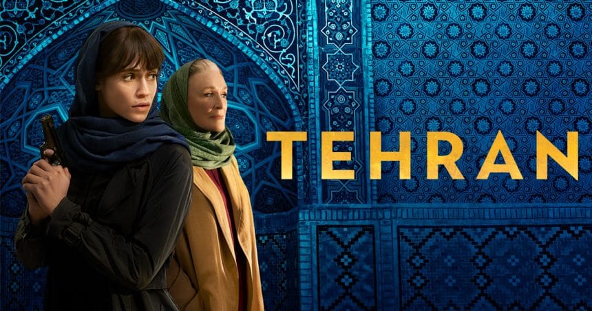 Two lead characters from the series Tehran standing in front of blue mosaic tiles.