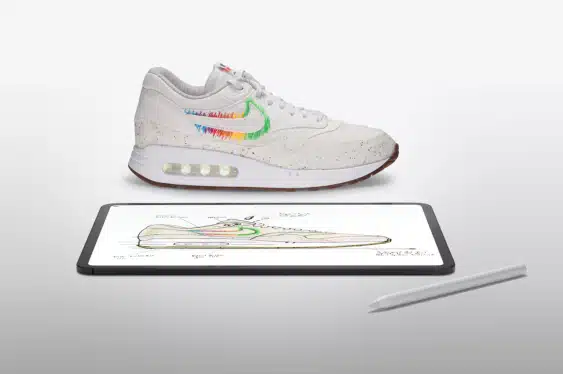Nike sneaker displayed above a digital design sketch on a tablet.