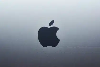 Black Apple logo on a silver background.