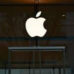 Apple logo on a glass storefront.