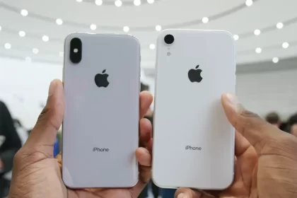 Two iPhones held side by side, showing their backs.