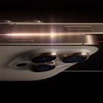 Close-up of an iPhone with triple cameras and a glowing metallic edge.