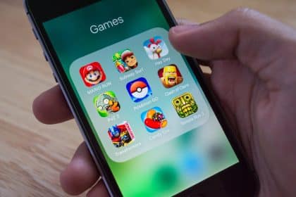 iPhone screen showing a folder of mobile game apps.