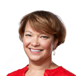 Portrait of Lisa Jackson smiling against a white background.