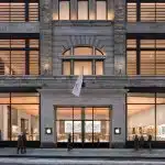 Exterior of Apple Sainte-Catherine store in Montreal at night.