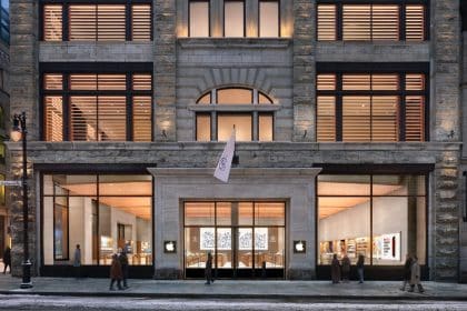 Exterior of Apple Sainte-Catherine store in Montreal at night.