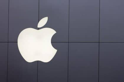 Apple logo on a dark wall.