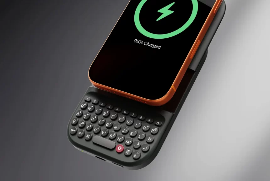 MagSafe keyboard battery attached to a smartphone with physical keys.