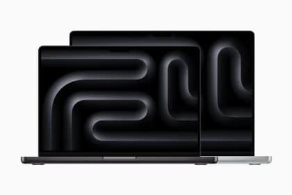 Two MacBook Pro laptops with dark screens.