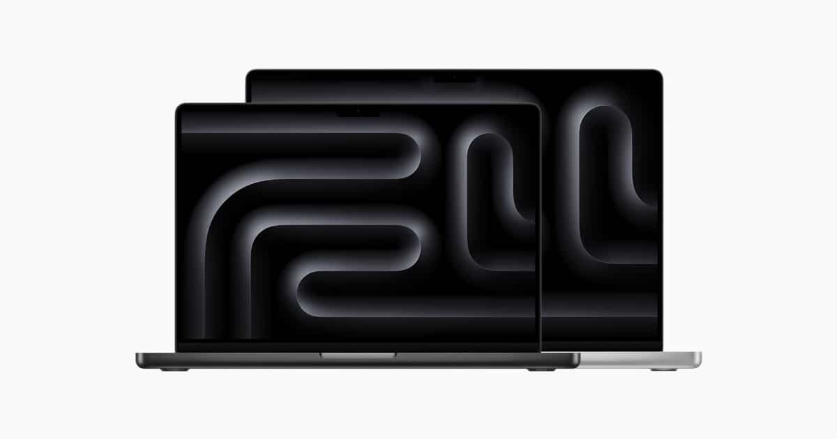 Two MacBook Pro laptops with dark screens.