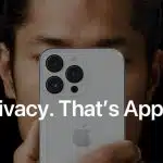 Person holding an iPhone with the text &ldquo;Privacy. That&rsquo;s Apple."
