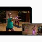 Apple Fitness+ workout shown on iPad, iPhone, Apple Watch, and AirPods.