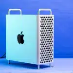 Apple Mac Pro desktop computer shown against a blue background.