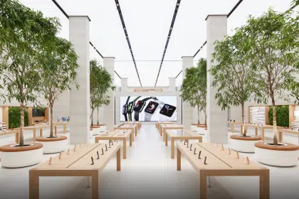 Apple Regent Street store interior with display tables and trees.