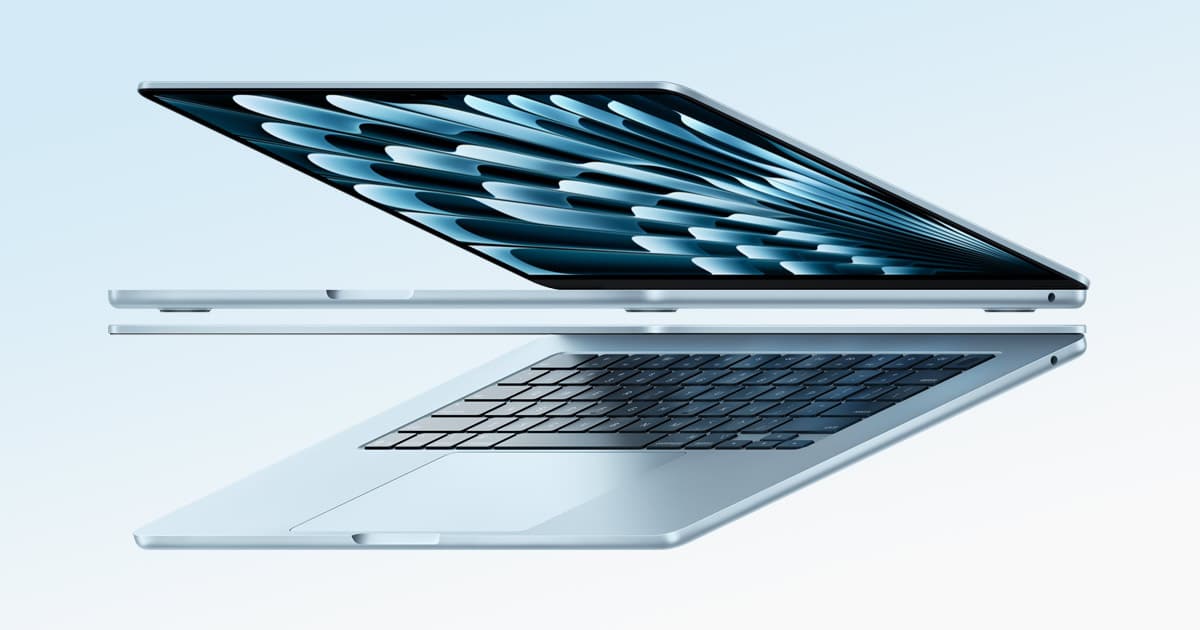 Side view of a slim light blue MacBook Air with the lid partially open, showing its thin design and keyboard.