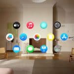 Apple Vision Pro home screen with floating app icons displayed in a living room scene.
