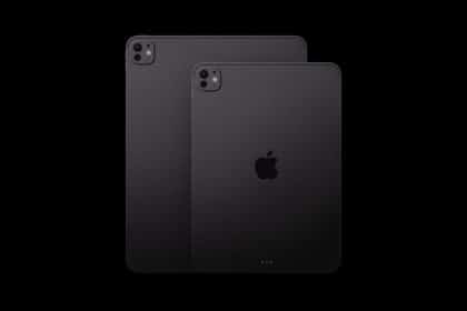 Two dark gray Apple iPad Pro tablets shown from the back against a black background.
