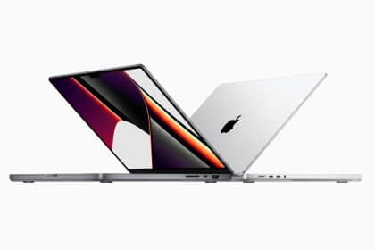 Two MacBook laptops shown side by side, one open and one closed.